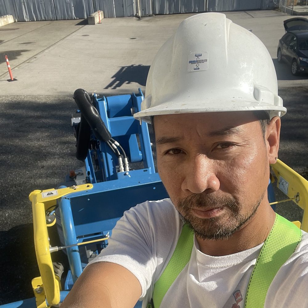 Jack, owner of 3 Pro Painting, on site in safety gear